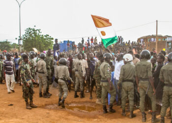 Niger's junta supporters take part in a demonstration in front of a French army base in Niamey,