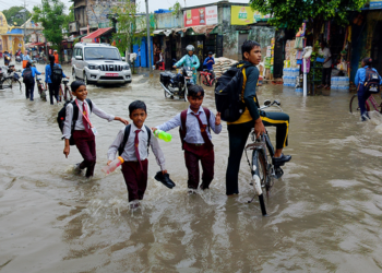Going To School Through Inundated Road