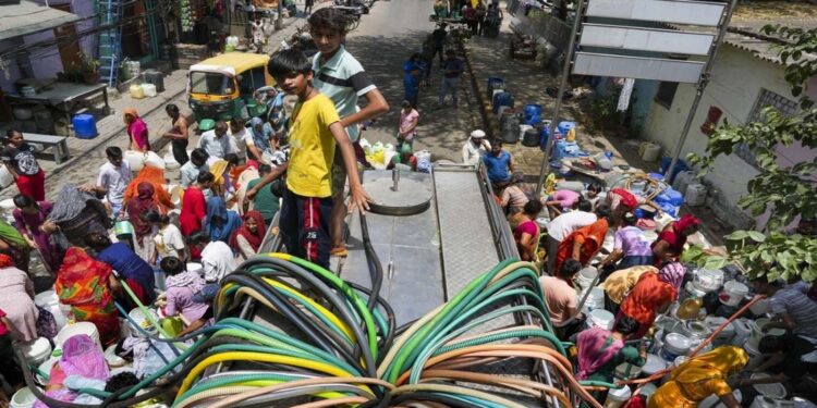 Delhi water crisis, summer heat, water tankers, queues, Mayur Vihar, Sanjay Colony, Okhla, Geeta Colony, Water Minister Atishi, hunger strike, Haryana government, BJP MP Bansuri Swaraj, AAP government, illegal tanker mafia